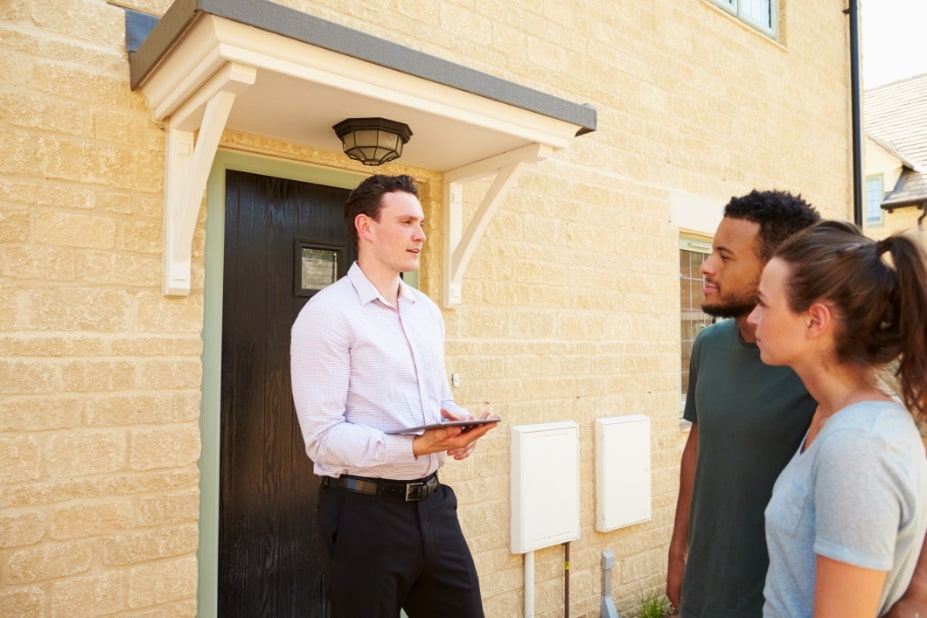 Couple talking with their broker