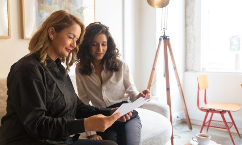 Woman in discussion with her broker