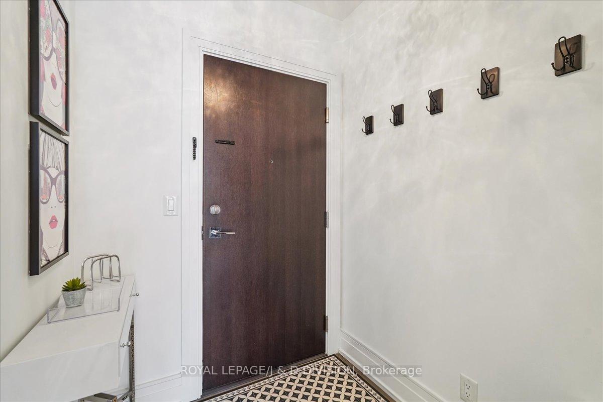 Foyer with closet and custom closet organizers