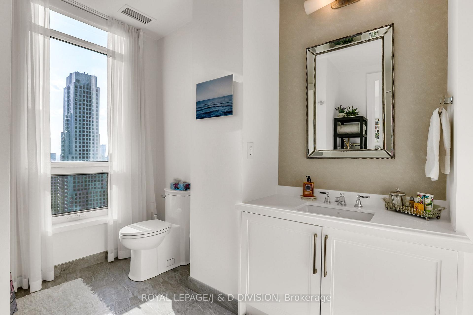 Guest bedroom ensuite with a large window