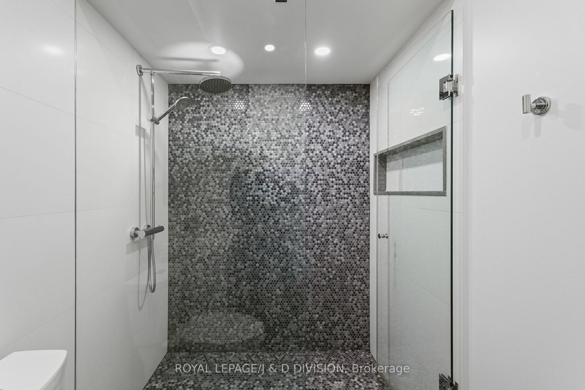 Beautiful glass shower with custom tiling