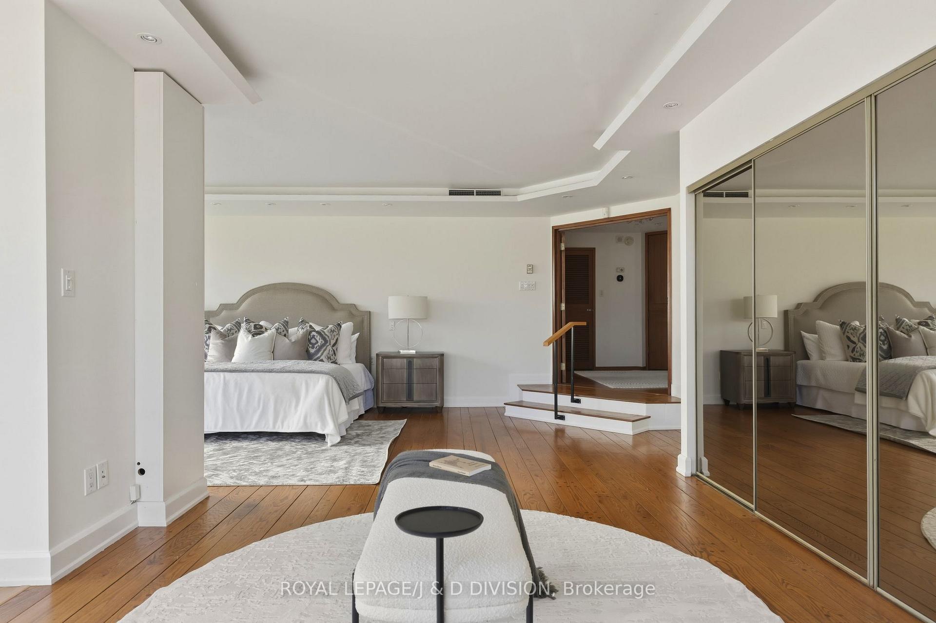 Quadruple mirrored closets in Primary