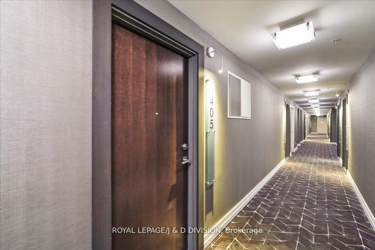 Suite entry door, wide hallways, finished ceilings