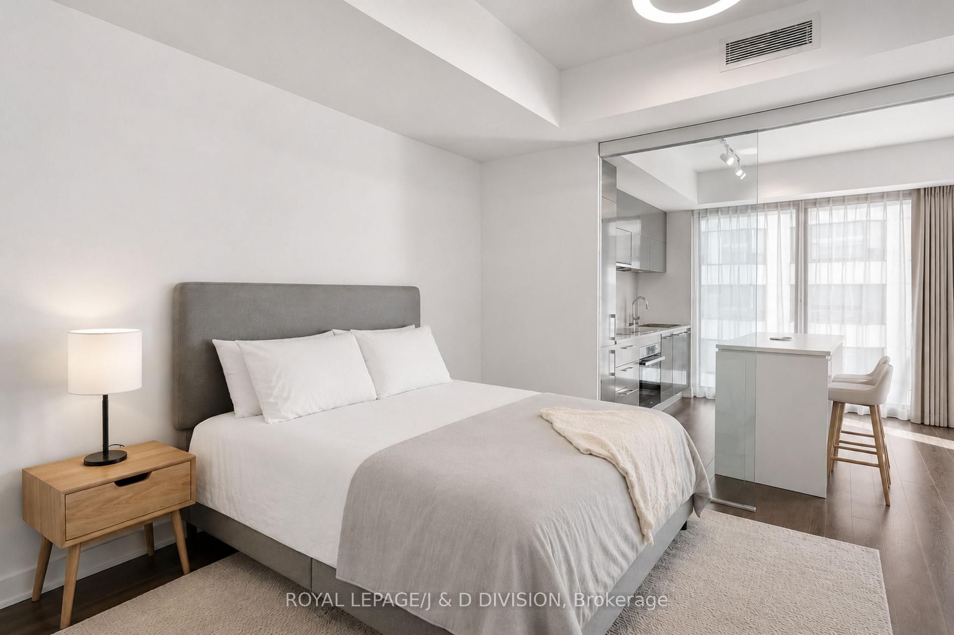 virtually staged with center island, bed, curtains