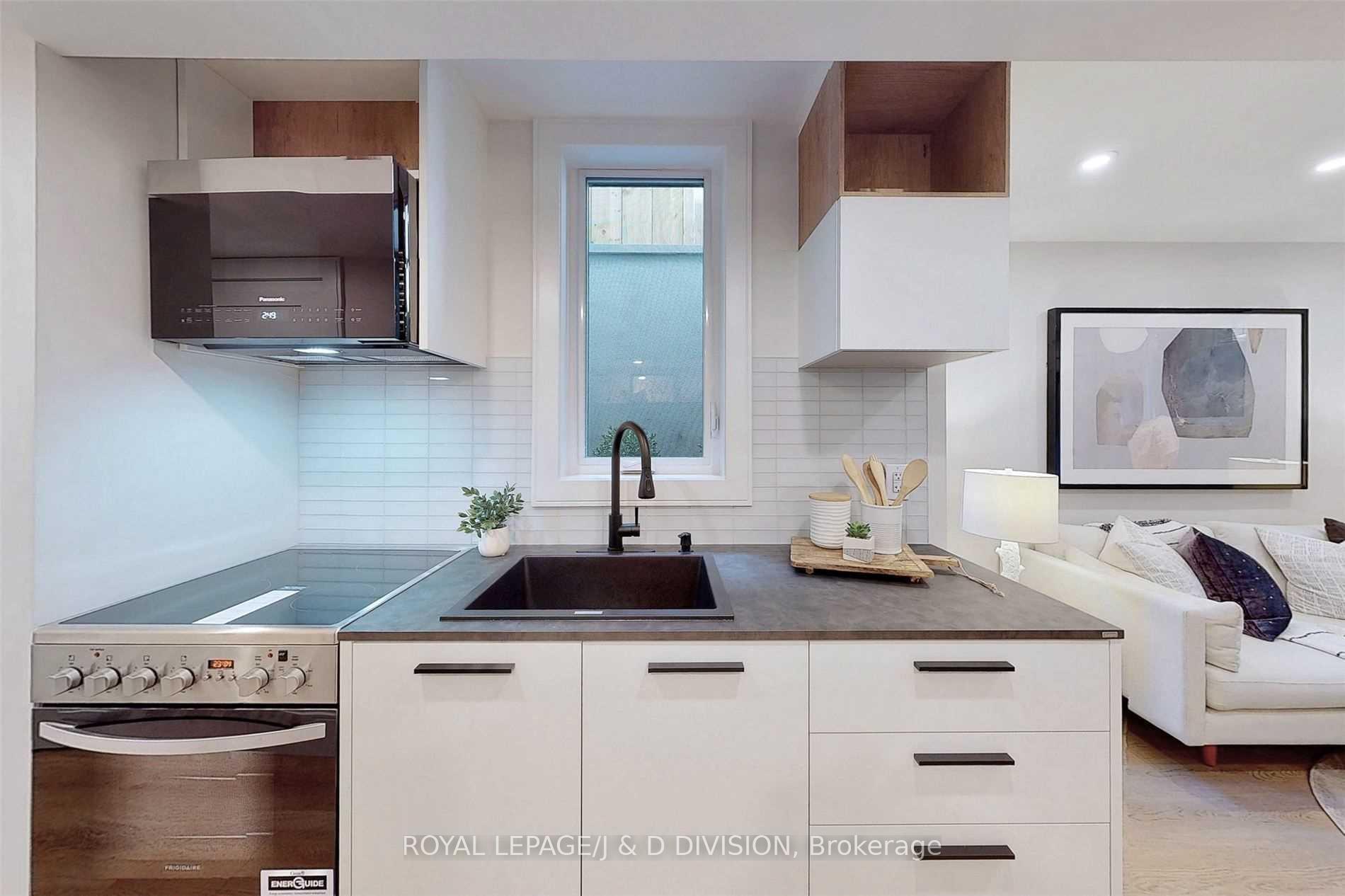 Kitchen w large above grade window