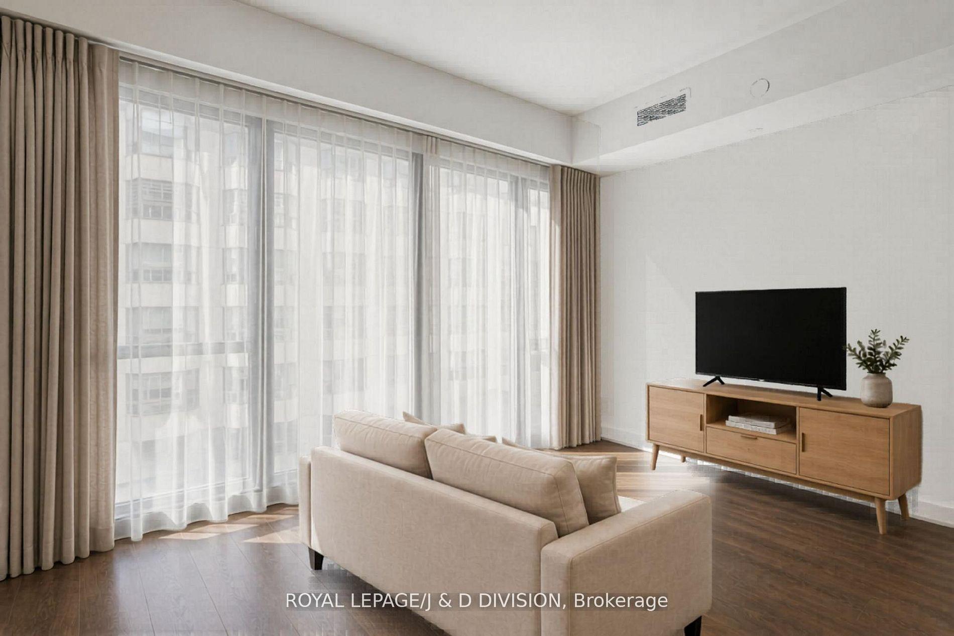 virtually staged with couch & TV and curtains