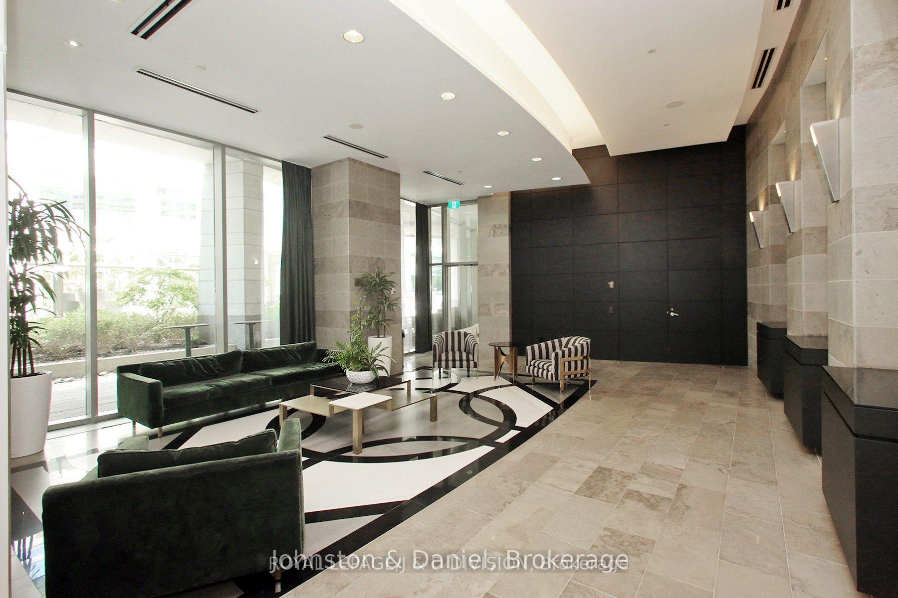 Luxurious building lobby with 24/7 conceirge