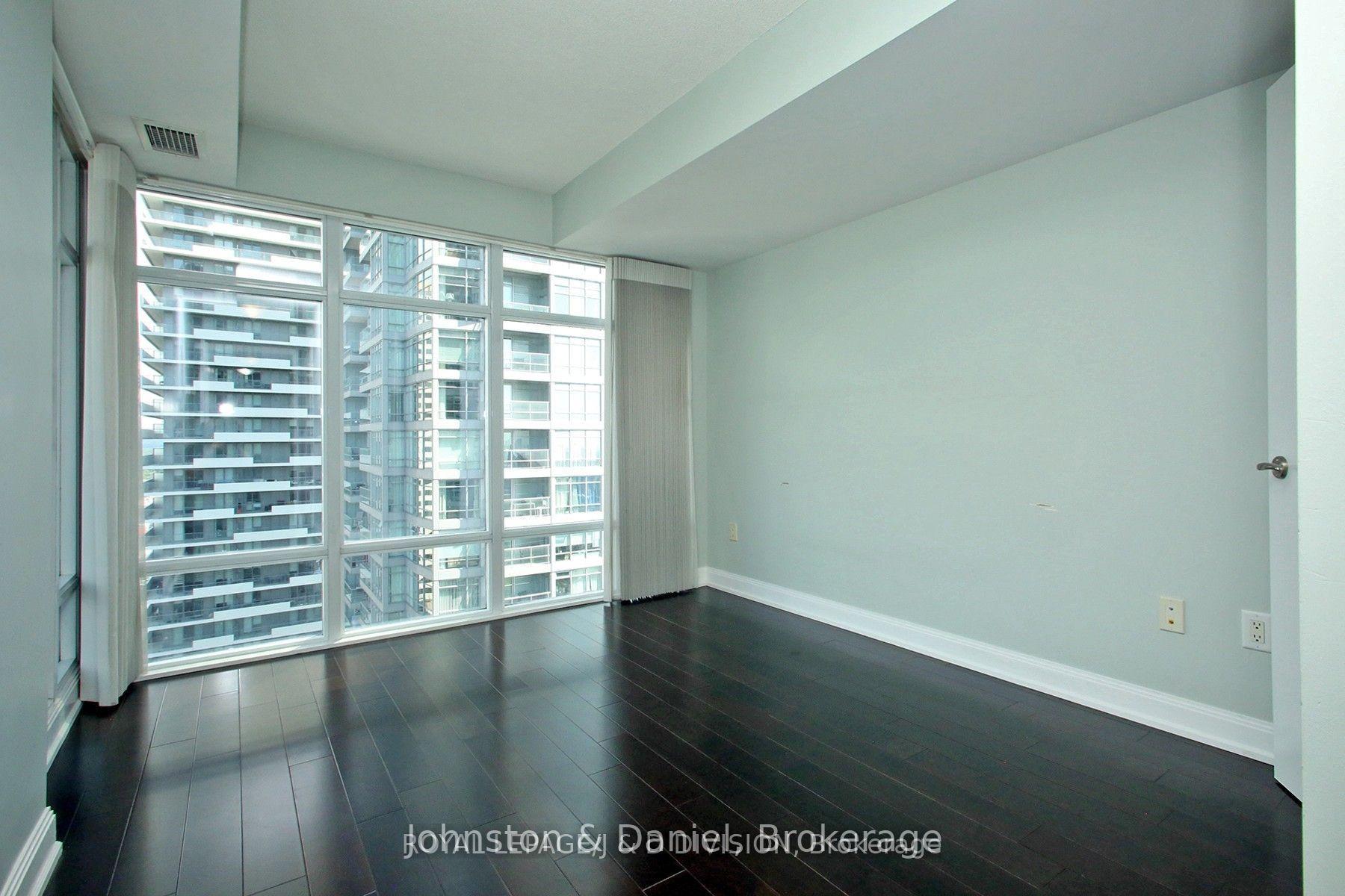 2nd bedroom with floor to ceiling windows