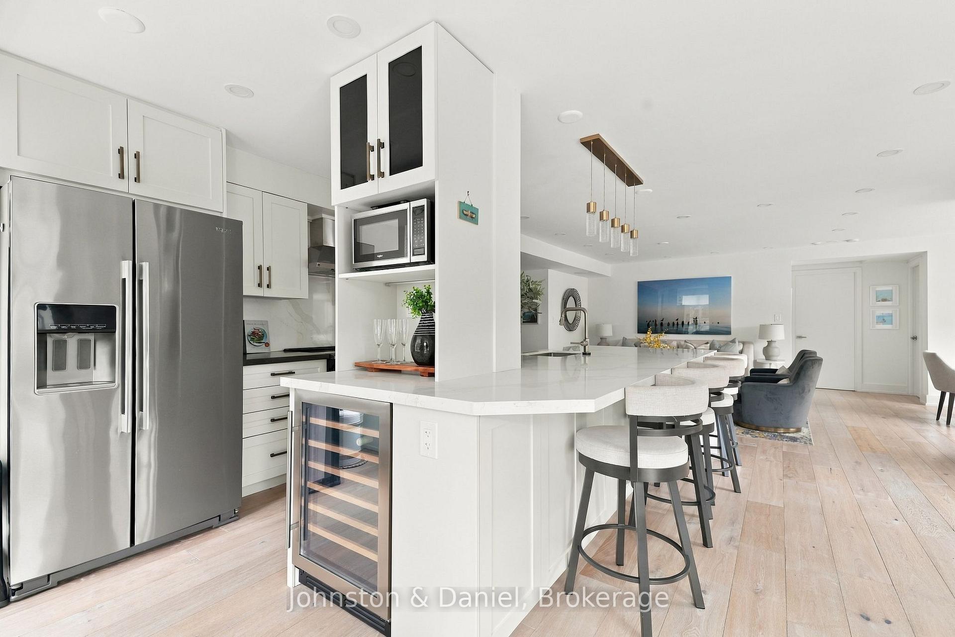 Bar fridge and SS appliances throughout