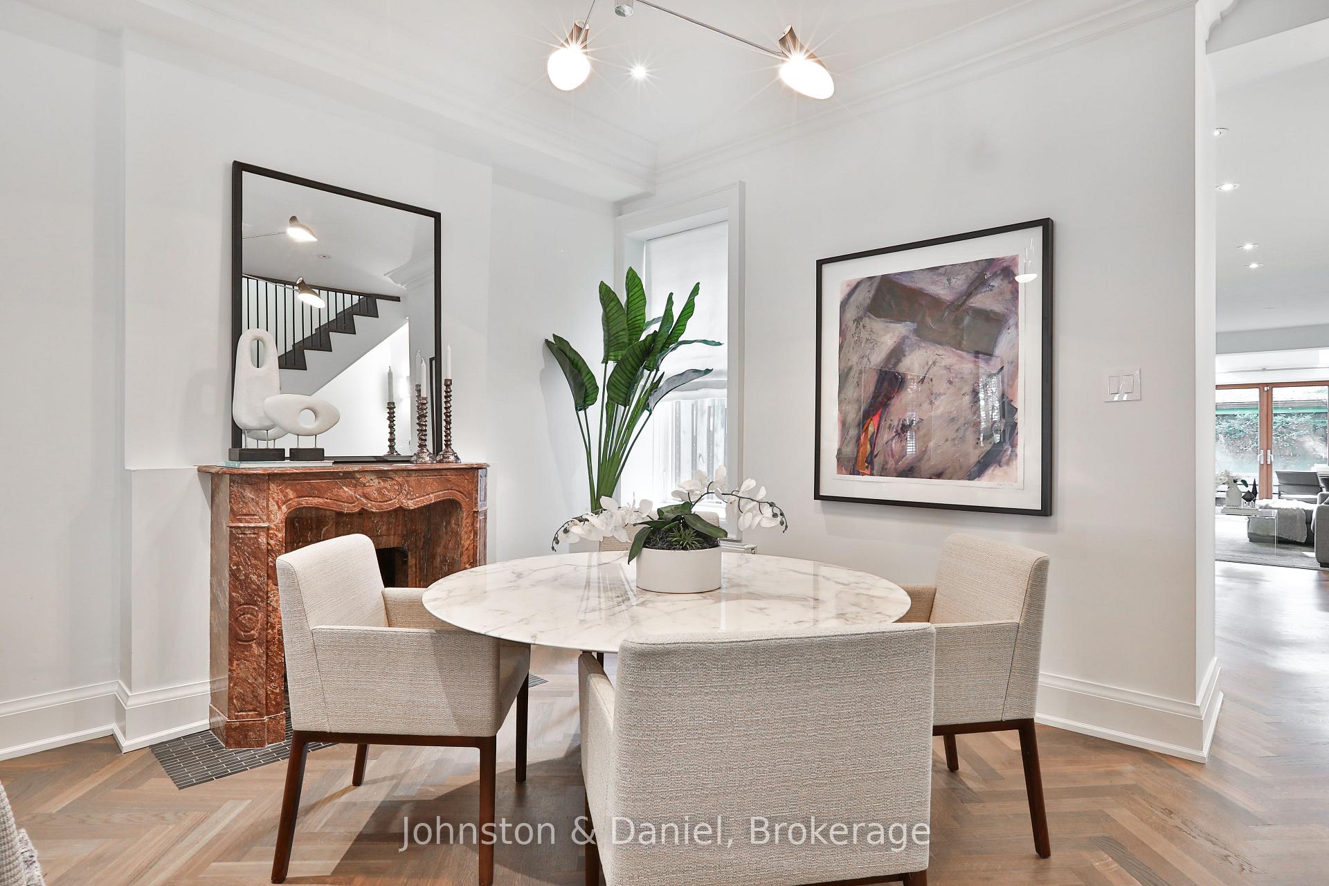 Elegant dining room with marble fireplace