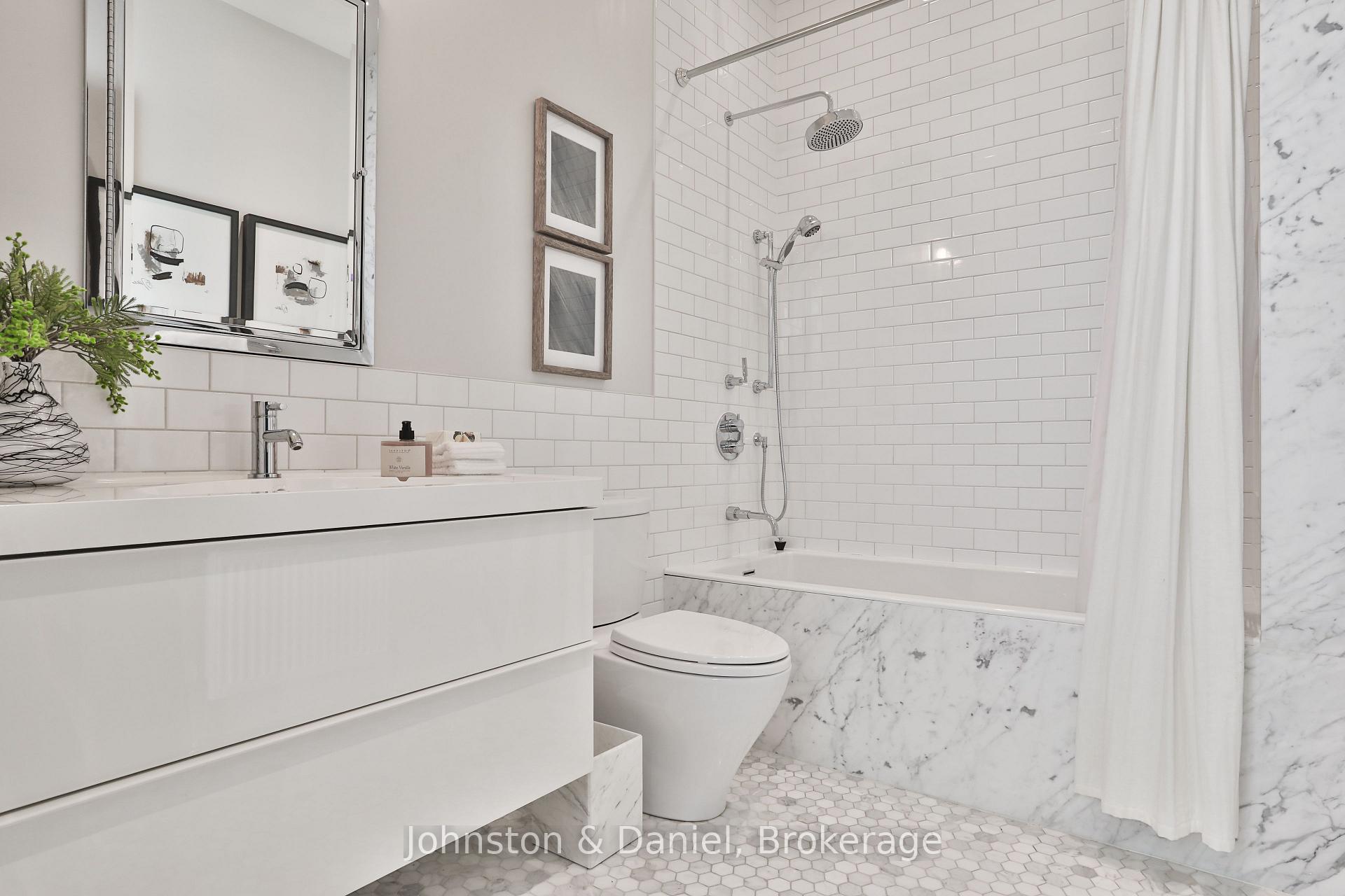 Main 4-piece Calcutta marble bath, heated floors