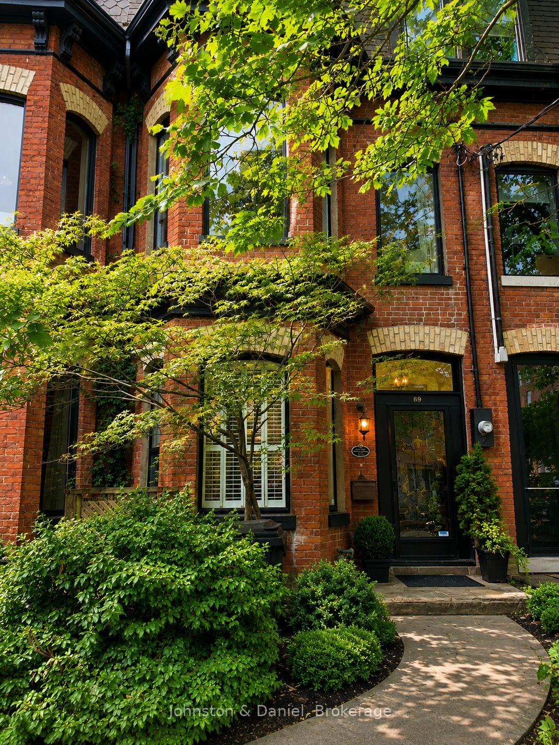 Striking red brick Victorian w/ polychrome facade