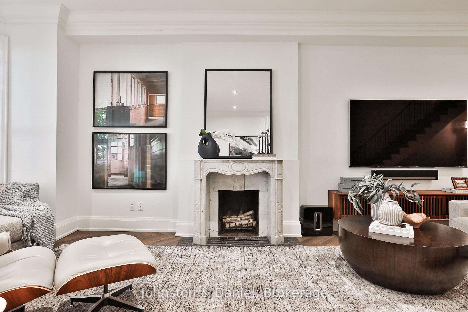 Two gorgeous marble fireplaces flank living space