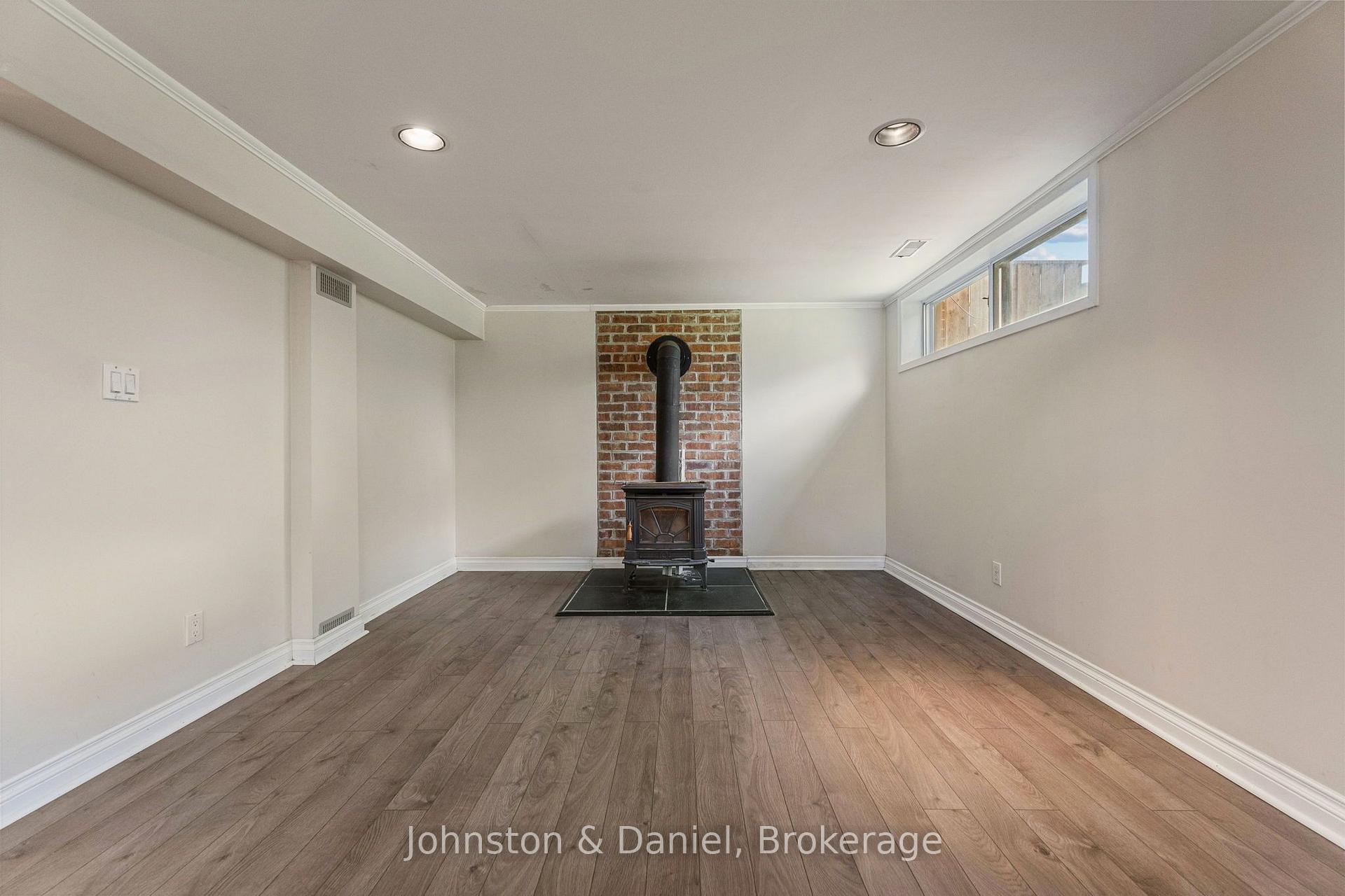 Recreation Room w Woodstove Fireplace