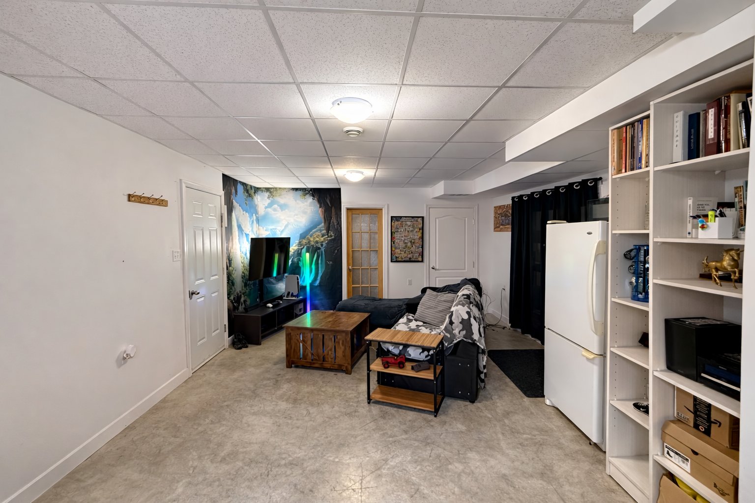 Spacious room with polished concrete flooring.