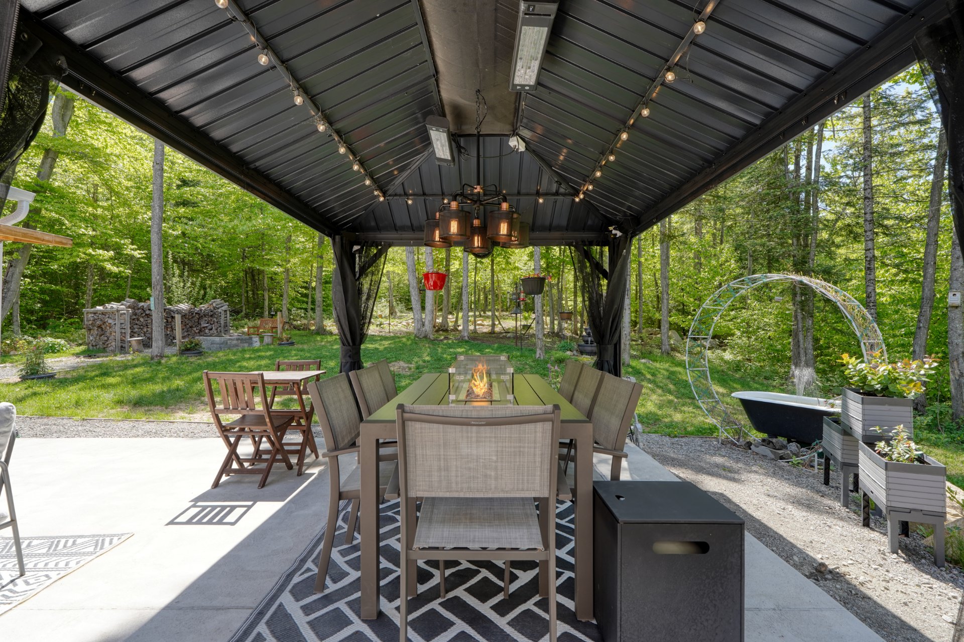 Illuminated pergola + furniture & central fireplac
