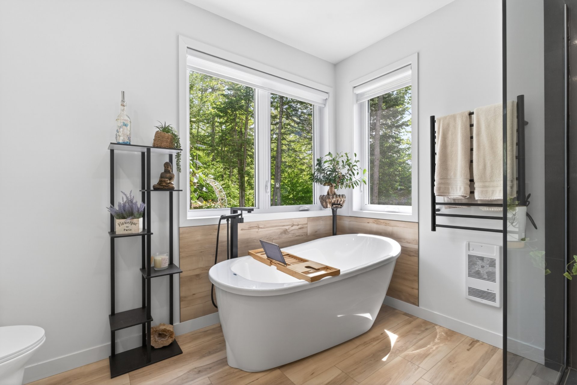 Freestanding bathtub and heated towel rail